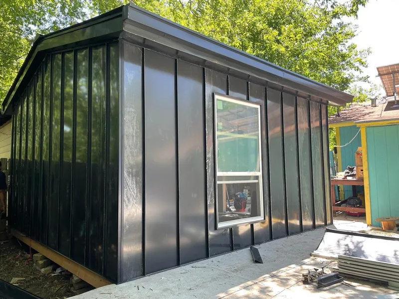 Black standing seam metal wall panels for Roof Inspection in Westborough