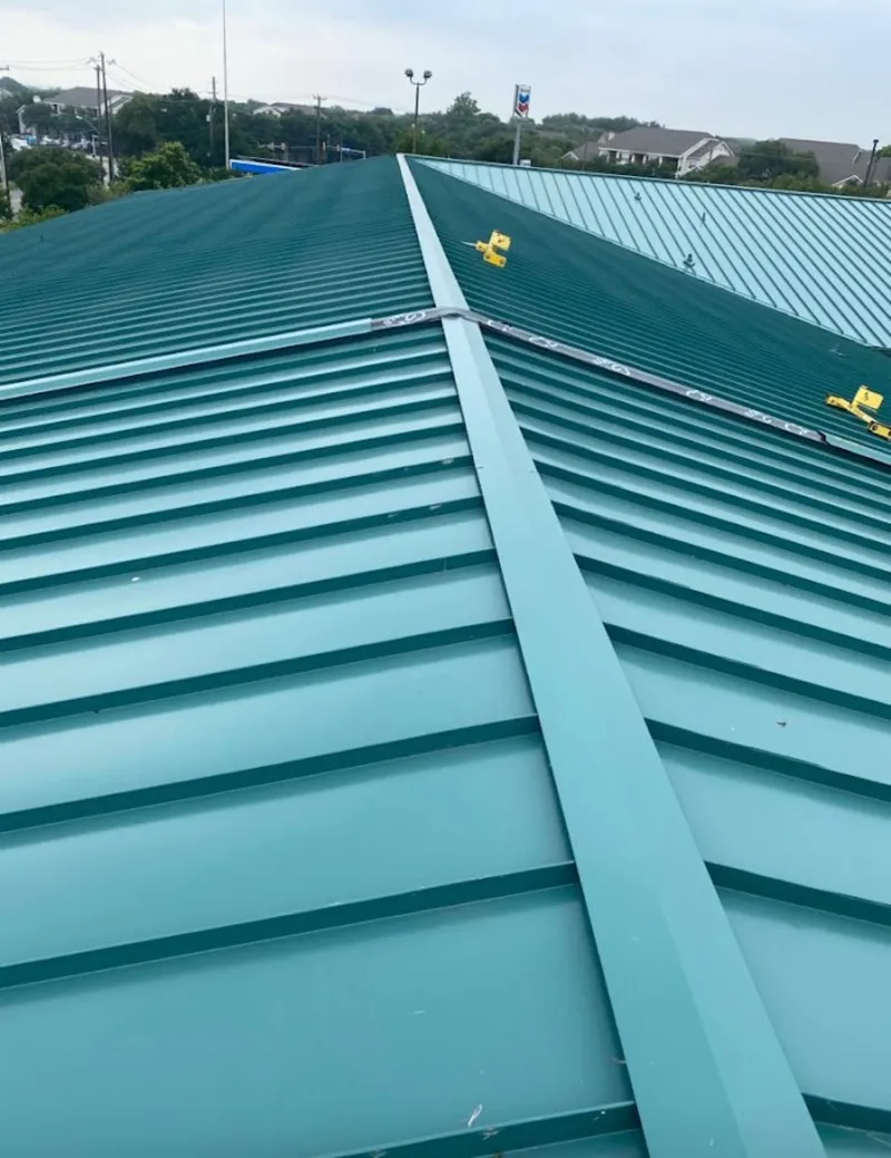 Green commercial metal roof ridge and valley for Metal Roof Repair in Westborough
